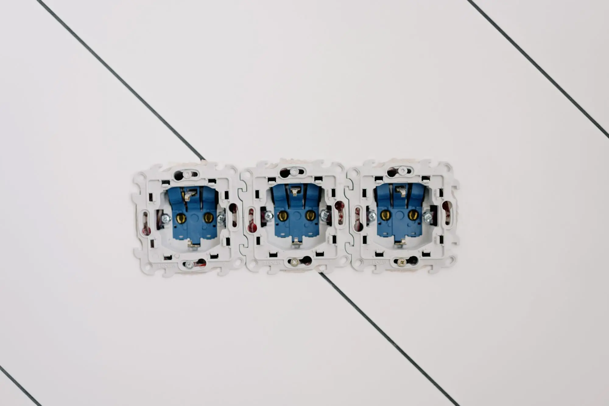 Wall sockets and switches in a room at home